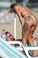 TINA LOUISE in Bikini and Brian Austin Green at a Beach in Los Angeles 08/31/2020