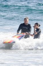ZOE SALDANA in Wetsuit at Surf Session in Malibu 09/20/2020
