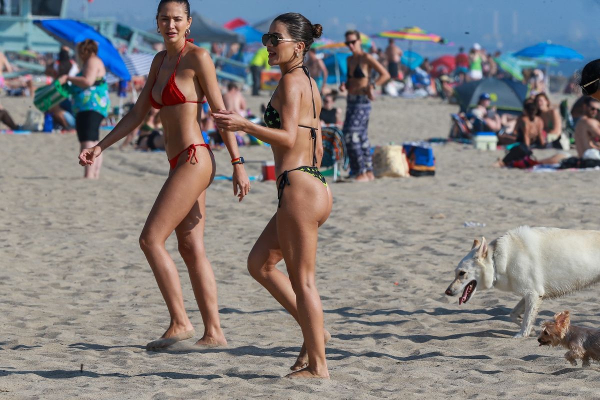 Camila Coelho – In red bikini plays beach volleyball in Santa