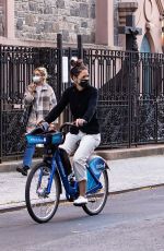 KATIE HOLMES and Emilio Vitolo Jr. Kissing Out Riding Bikes in New York 10/15/2020