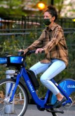 KATIE HOLMES and Emilio Vitolo Jr. Out Riding Citi Bikes in New York 10/20/2020
