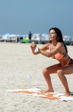 LAURA ANDERSON in Bikini Doing Yoga at a Beach in Dubai 10/08/2020