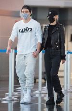 NICOLA PELTZ and Brooklyn Beckham at JFK AIrport in New York 11/07/2020
