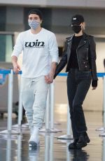 NICOLA PELTZ and Brooklyn Beckham at JFK AIrport in New York 11/07/2020