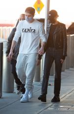 NICOLA PELTZ and Brooklyn Beckham at JFK AIrport in New York 11/07/2020