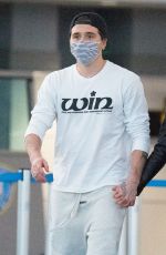NICOLA PELTZ and Brooklyn Beckham at JFK AIrport in New York 11/07/2020