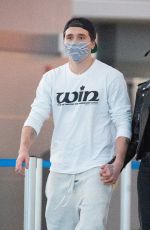 NICOLA PELTZ and Brooklyn Beckham at JFK AIrport in New York 11/07/2020