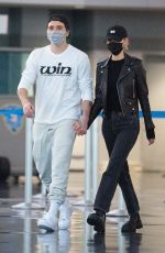 NICOLA PELTZ and Brooklyn Beckham at JFK AIrport in New York 11/07/2020
