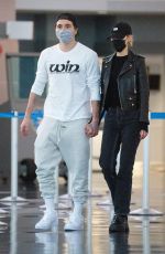 NICOLA PELTZ and Brooklyn Beckham at JFK AIrport in New York 11/07/2020