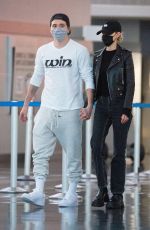 NICOLA PELTZ and Brooklyn Beckham at JFK AIrport in New York 11/07/2020