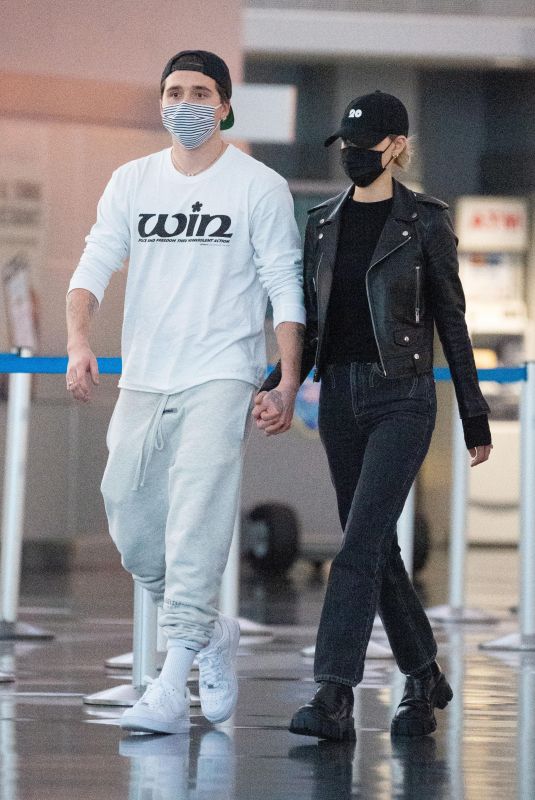 NICOLA PELTZ and Brooklyn Beckham at JFK AIrport in New York 11/07/2020