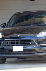 CHARLIZE THERON Leaves Gym in her Porsche in Beverly Hills 12/20/2020
