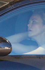 CHARLIZE THERON Leaves Gym in her Porsche in Beverly Hills 12/20/2020