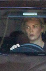 CHARLIZE THERON Leaves Gym in her Porsche in Beverly Hills 12/20/2020