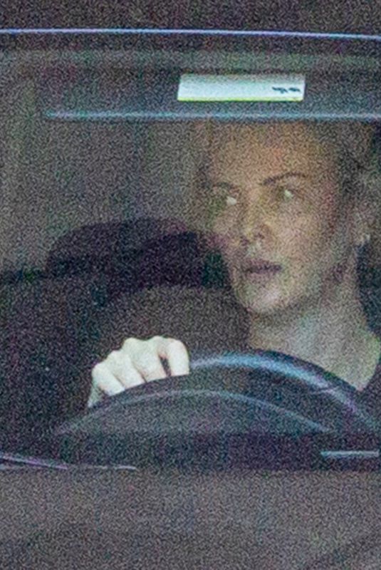 CHARLIZE THERON Leaves Gym in her Porsche in Beverly Hills 12/20/2020