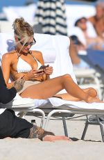 CHARLOTTE MCKINNEY in Bikini Top at a Beach in Miami 12/19/2020