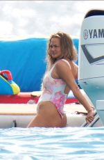CHRISSY TEIGEN in Swimsuit at a Boat in St.Barth 12/29/2020