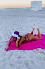 CLAUDIA ROMANI in Bikini and a Santa Hat on the Beach in Miami 12/01/2020