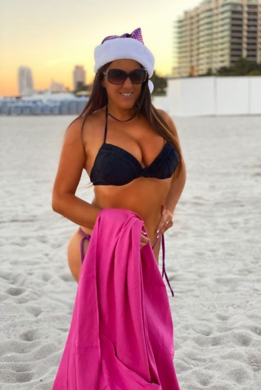 CLAUDIA ROMANI in Bikini and a Santa Hat on the Beach in Miami 12/01/2020