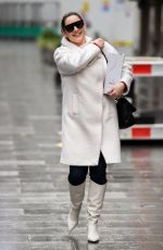 KELLY BROOK in a White Coat and Boots at Global Radio in London 12/23/2020