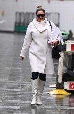 KELLY BROOK in a White Coat and Boots at Global Radio in London 12/23/2020