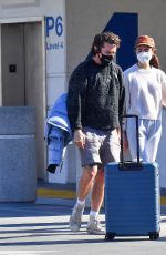 MARGARET QUALLEY and Shia LaBeouf Out Kissing at LAX Airport 12/19/2020