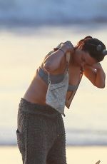 MICHELLE RODRIGUEZ in Bikini Surfing in Malibu 12/03/2020