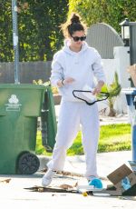 SARA SAMPAIO Cleaning Trash Outside Her Home in Los Angeles 12/10/2020