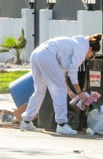 SARA SAMPAIO Cleaning Trash Outside Her Home in Los Angeles 12/10/2020