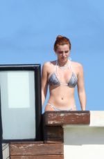 BELLA THORNE in Bikini at a Hotel Pool in Tulum 01/09/2021