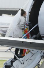 CHRISSY TEIGEN Out Boarding a Private Jet in Los Angeles 01/19/2021