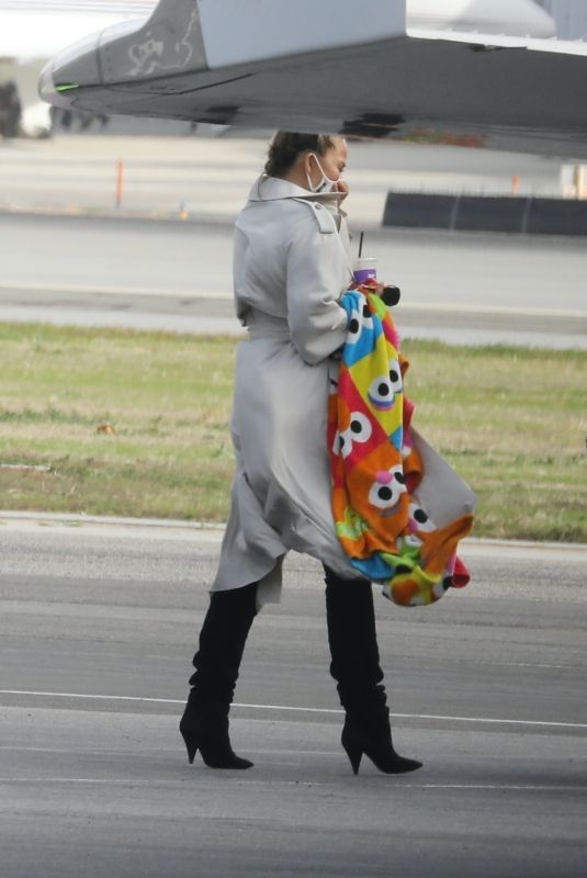 CHRISSY TEIGEN Out Boarding a Private Jet in Los Angeles 01/19/2021