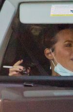 KATE BECKINSALE Out Smoking in a Car in Beverly Hills 01/18/2021