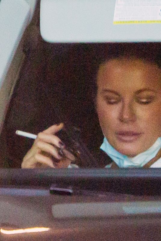 KATE BECKINSALE Out Smoking in a Car in Beverly Hills 01/18/2021