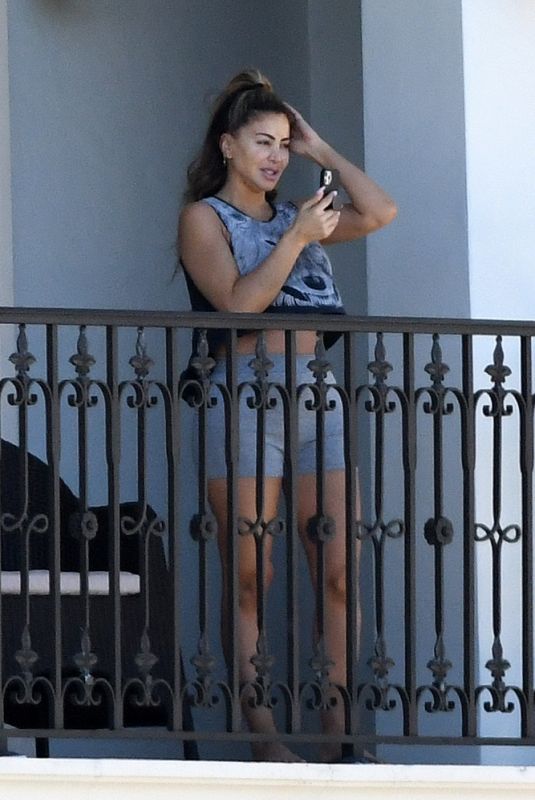 LARSA PIPPEN Chats on the Phone on Her Balcony in Ft. Lauderdale 01/21/2021