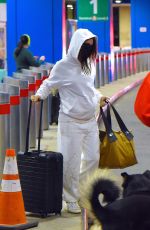 Pregnant EMILY RATAJKOWSKI and Sebastian Bear McClard at Newark Liberty International Airport in New Jersey 01/08/2021