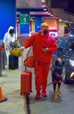 Pregnant EMILY RATAJKOWSKI and Sebastian Bear McClard at Newark Liberty International Airport in New Jersey 01/08/2021