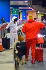 Pregnant EMILY RATAJKOWSKI and Sebastian Bear McClard at Newark Liberty International Airport in New Jersey 01/08/2021