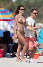 AMELIA HAMLIN in Bikini and Scott Disick at a Beach in Miami 02/12/2021