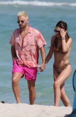 AMELIA HAMLIN in Bikini and Scott Disick at a Beach in Miami 02/12/2021