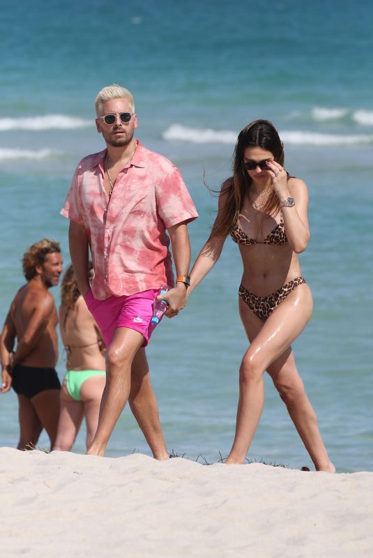 AMELIA HAMLIN in Bikini and Scott Disick at a Beach in Miami 02/12/2021