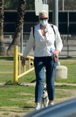 BRIGITTE NIELSEN Out with her Dog at a Park in Los Angeles 02/07/2021