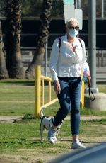 BRIGITTE NIELSEN Out with her Dog at a Park in Los Angeles 02/07/2021