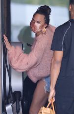 CHRISSY TEIGEN in a Denim Shorts Out in Los Angeles 02/11//2021