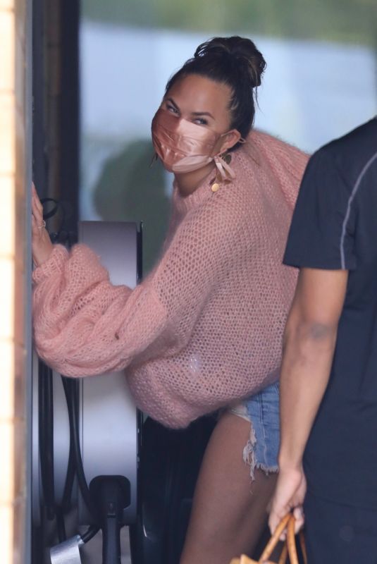 CHRISSY TEIGEN in a Denim Shorts Out in Los Angeles 02/11//2021