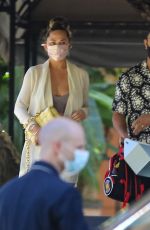CHRISSY TEIGEN Leaves Wolfgang Puck at Hotel Bel-Air 02/22/2021