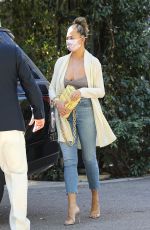 CHRISSY TEIGEN Leaves Wolfgang Puck at Hotel Bel-Air 02/22/2021