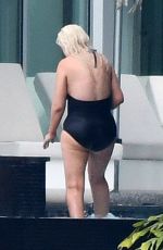 CHRISTINA AGUILRA in Swimsuit at a Pool in Miami 02/12/2021