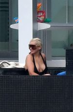CHRISTINA AGUILRA in Swimsuit at a Pool in Miami 02/12/2021