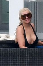 CHRISTINA AGUILRA in Swimsuit at a Pool in Miami 02/12/2021